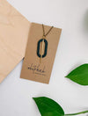 Geometric Oval Leather Brass Accent Necklace